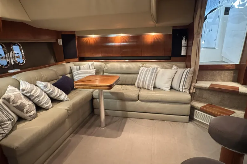  Yacht Photos Pics Luxurious interior of 2005 Cruisers Yachts 420 Express with plush seating and elegant decor.