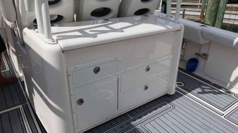 Big Sea Yacht Photos Pics 2020 Cobia 350 Center Console boat interior with storage compartments and seating.