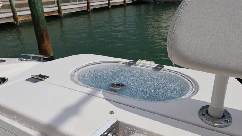 Big Sea Yacht Photos Pics 2020 Cobia 350 Center Console boat with livewell and seating, docked by the water.