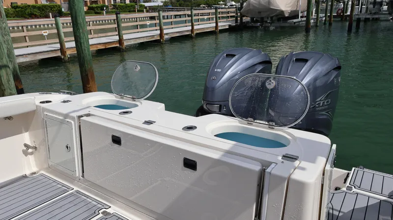 Big Sea Yacht Photos Pics 2020 Cobia 350 Center Console boat with twin outboard engines docked at marina.