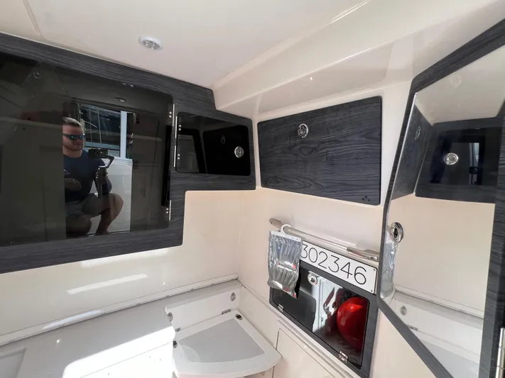 Big Sea Yacht Photos Pics 2020 Cobia 350 Center Console interior with sleek cabinetry and modern design.