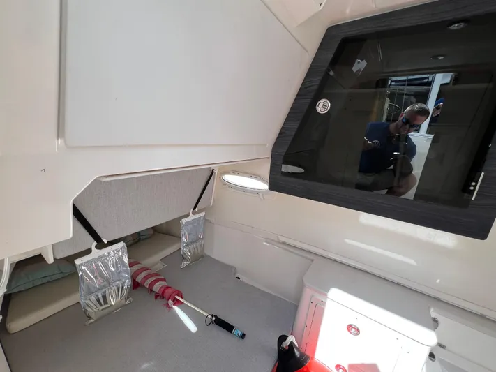 Big Sea Yacht Photos Pics Interior of 2020 Cobia 350 Center Console boat with storage and seating area.