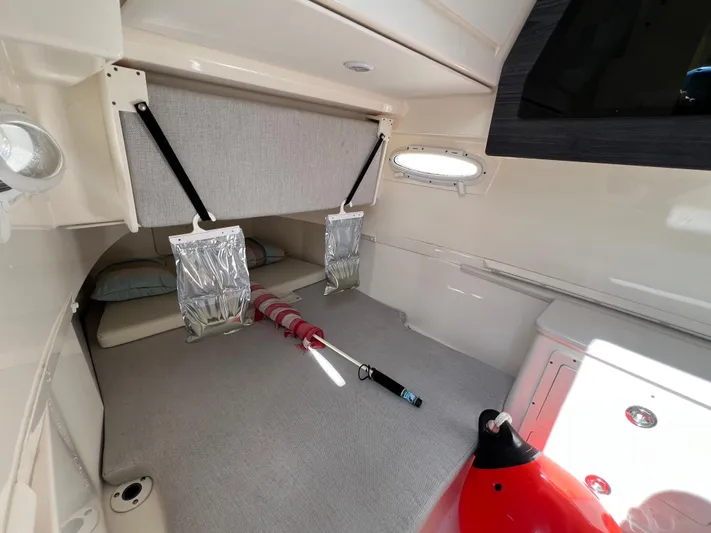 Big Sea Yacht Photos Pics 2020 Cobia 350 Center Console cabin interior with storage and safety equipment.