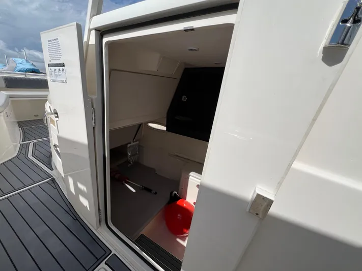 Big Sea Yacht Photos Pics 2020 Cobia 350 Center Console boat interior with open storage compartment.