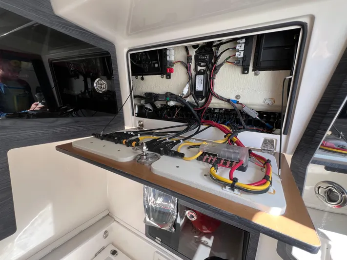 Big Sea Yacht Photos Pics Electrical panel inside 2020 Cobia 350 Center Console boat, showcasing wiring and components.