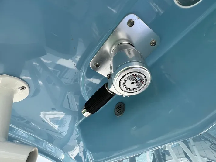 Big Sea Yacht Photos Pics Close-up of a 2020 Cobia 350 Center Console boat's blue interior with a mounted control handle.