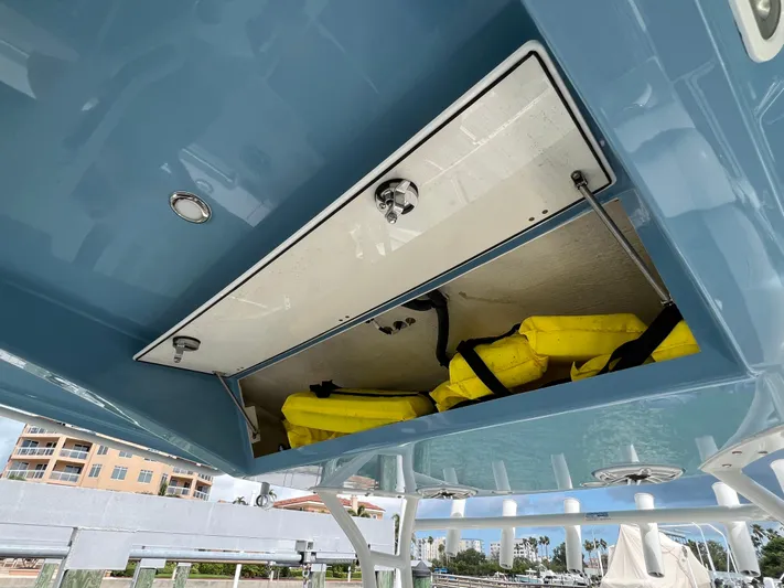 Big Sea Yacht Photos Pics 2020 Cobia 350 Center Console storage compartment with yellow life jackets.