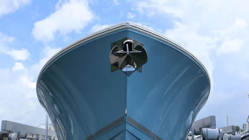 Big Sea Yacht Photos Pics 2020 Cobia 350 Center Console boat, front view against a cloudy sky.