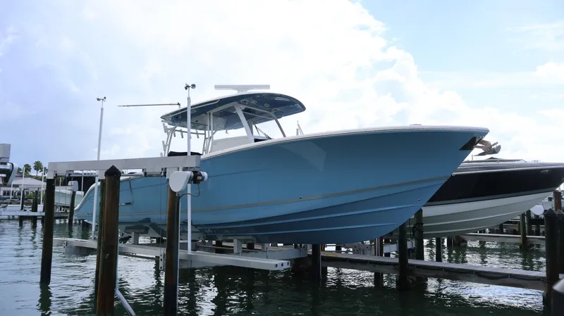 Big Sea Yacht Photos Pics 2020 Cobia 350 Center Console boat on lift at marina.