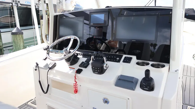 Big Sea Yacht Photos Pics 2020 Cobia 350 Center Console boat dashboard with steering wheel and electronic displays.