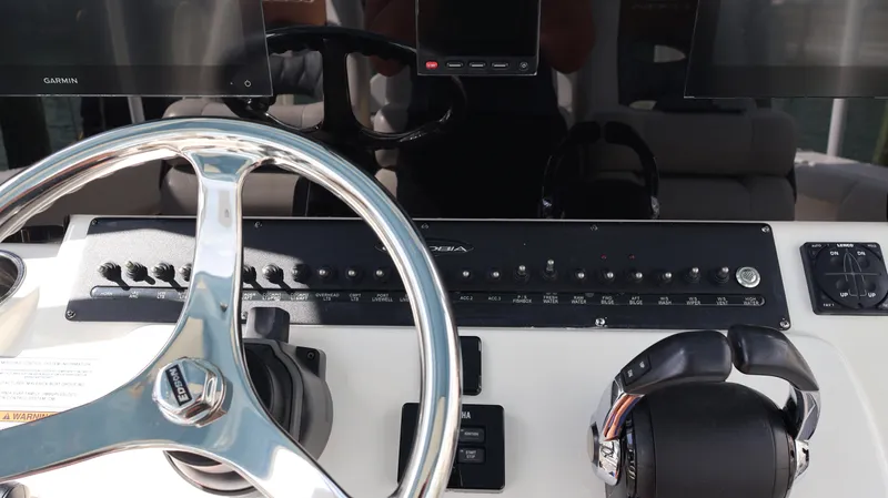 Big Sea Yacht Photos Pics Cobia 350 Center Console 2020 helm with steering wheel and control panel.