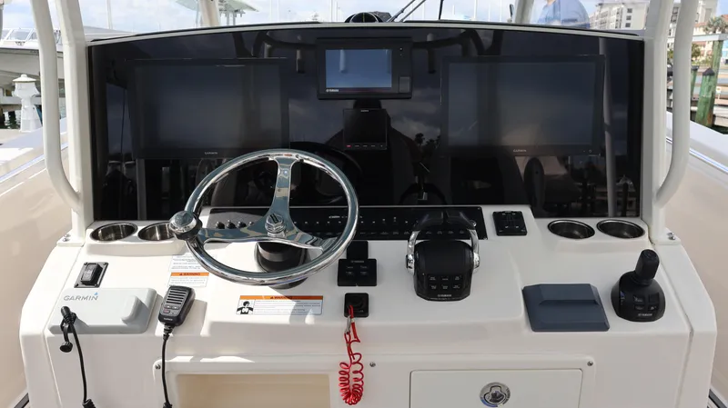 Big Sea Yacht Photos Pics 2020 Cobia 350 Center Console helm with Garmin displays and steering wheel.