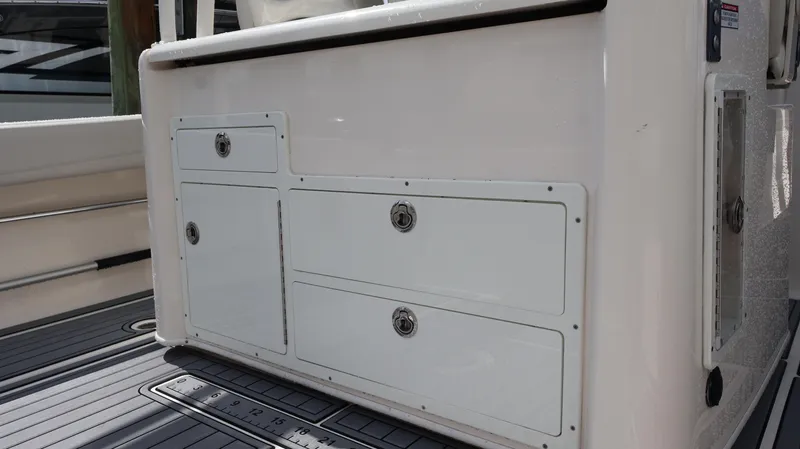Big Sea Yacht Photos Pics 2020 Cobia 350 Center Console storage compartments on deck.