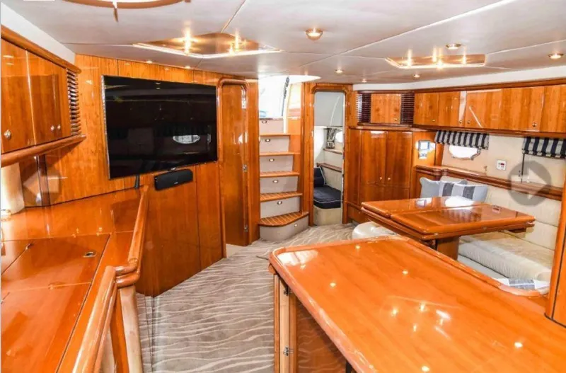  Yacht Photos Pics Luxurious interior of 1998 Sunseeker Predator 63 yacht with wooden furnishings and modern amenities.