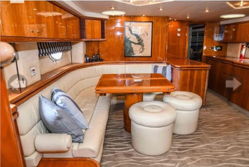  Yacht Photos Pics Luxurious interior of 1998 Sunseeker Predator 63 yacht with wooden finishes and plush seating.