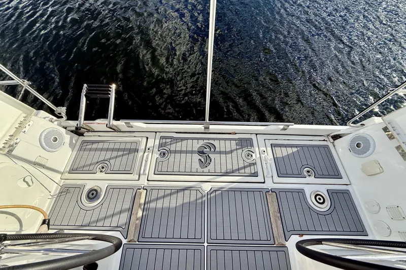  Yacht Photos Pics 2019 Beneteau Oceanis 35.1 yacht deck with water view and swim ladder.