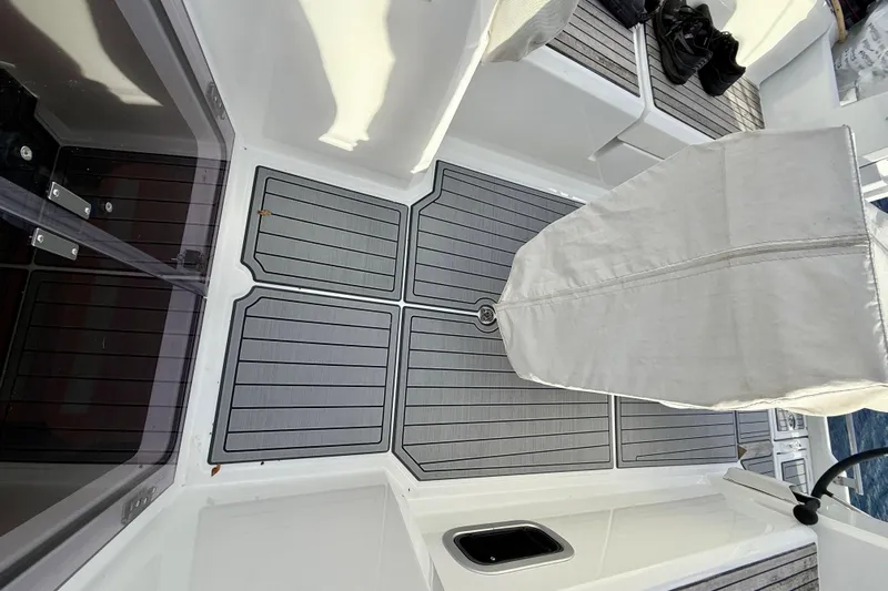  Yacht Photos Pics Cockpit of 2019 Beneteau Oceanis 35.1 sailboat with covered helm and teak flooring.