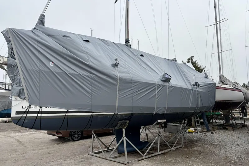  Yacht Photos Pics 2019 Beneteau Oceanis 35.1 sailboat covered and stored on stands in a boatyard.