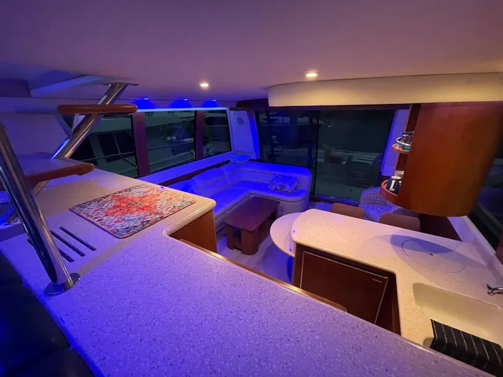 Relentless Yacht Photos Pics Luxurious interior of 1998 Carver 530 Voyager Pilothouse with modern lighting and seating.