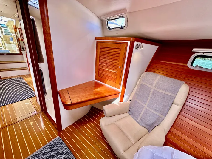 Southern Cross Yacht Photos Pics Luxurious 2017 MJM 50z yacht interior with wood paneling and comfortable seating.