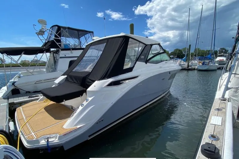 Hanamahina Yacht Photos Pics 2019 Sea Ray Sundancer 320 docked at marina under blue sky.