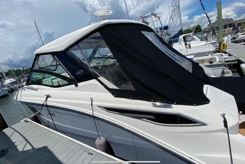 Hanamahina Yacht Photos Pics 2019 Sea Ray Sundancer 320 docked at marina under cloudy sky.