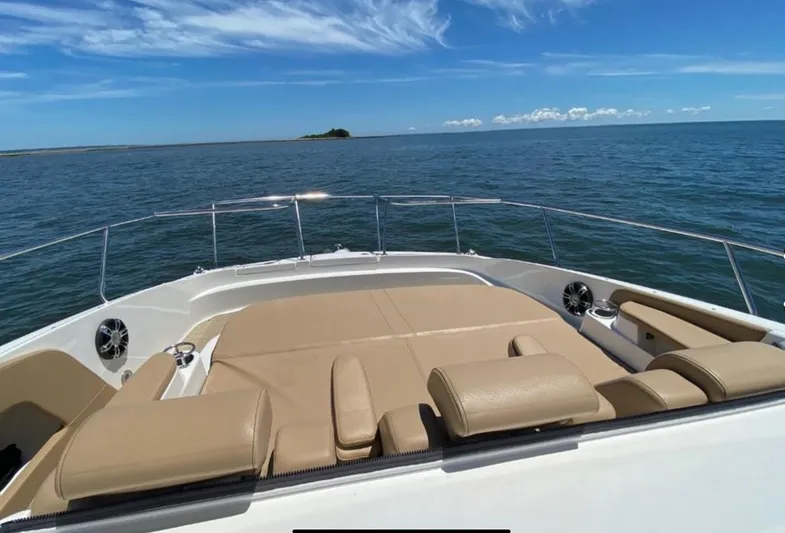 Hanamahina Yacht Photos Pics 2019 Sea Ray Sundancer 320 boat with sunpad, cruising on open water under blue sky.