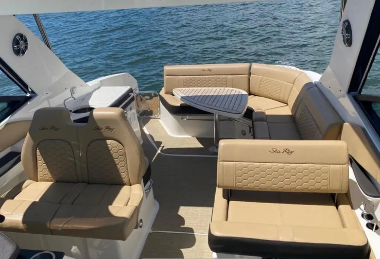 Hanamahina Yacht Photos Pics Luxurious 2019 Sea Ray Sundancer 320 interior with tan leather seating and ocean view.