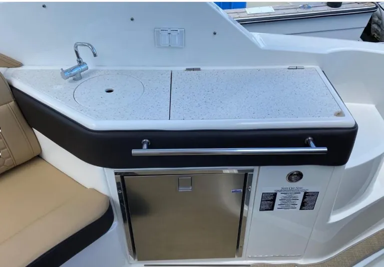 Hanamahina Yacht Photos Pics 2019 Sea Ray Sundancer 320 boat kitchenette with sink and storage.