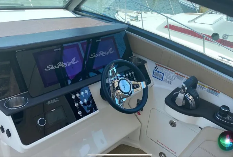 Hanamahina Yacht Photos Pics 2019 Sea Ray Sundancer 320 helm with modern controls and dual displays.