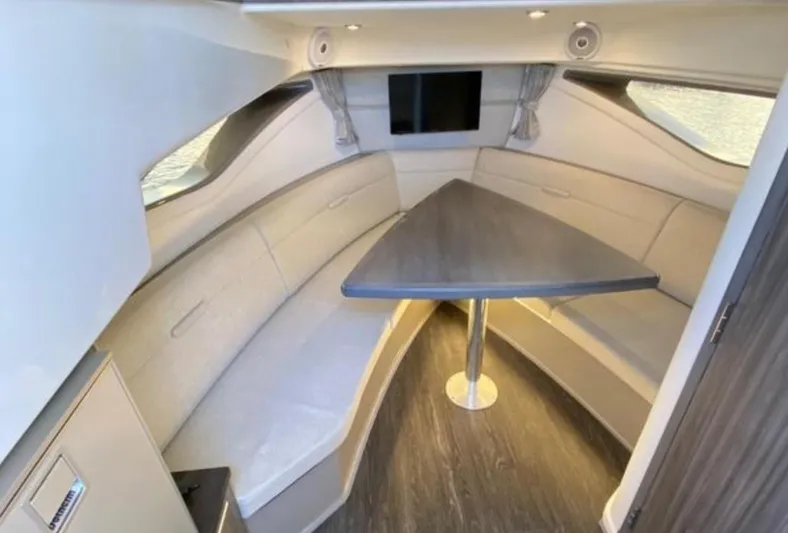 Hanamahina Yacht Photos Pics 2019 Sea Ray Sundancer 320 interior with modern seating and table.