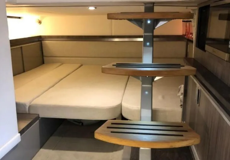 Hanamahina Yacht Photos Pics 2019 Sea Ray Sundancer 320 cabin interior with modern wooden steps and cozy bed.