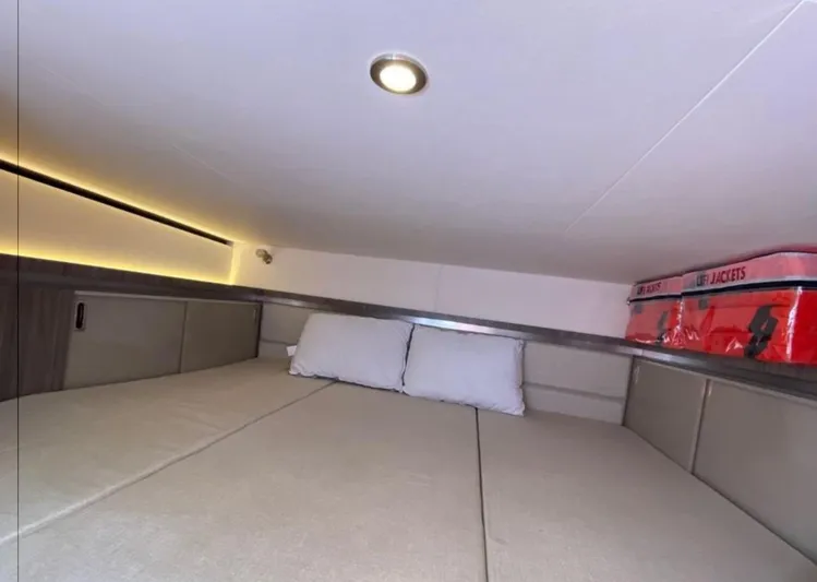 Hanamahina Yacht Photos Pics Interior cabin of 2019 Sea Ray Sundancer 320 with bed and life jackets.