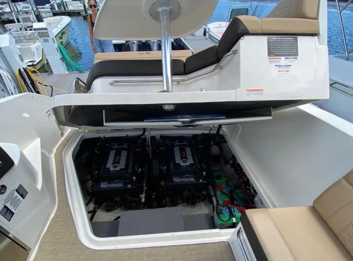 Hanamahina Yacht Photos Pics 2019 Sea Ray Sundancer 320 engine compartment with open hatch, docked at marina.