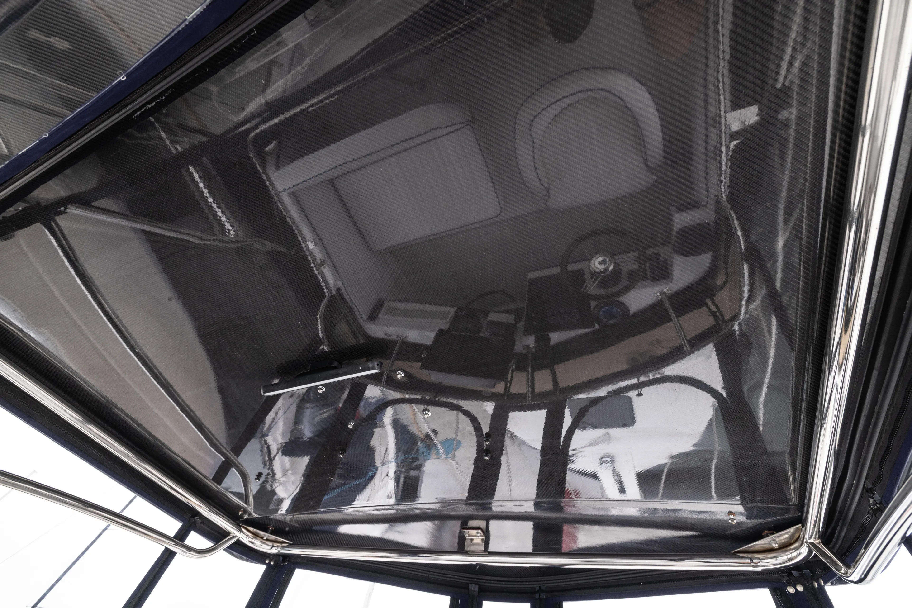 5th Kid Yacht Photos Pics 2023 Skipjack 26 Flybridge interior view with modern helm and seating.