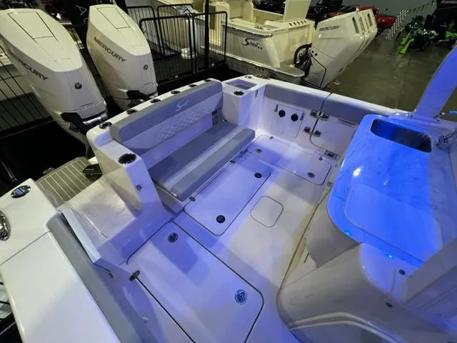  Yacht Photos Pics 2024 Scout 330 LXF boat interior with seating and Mercury engines.