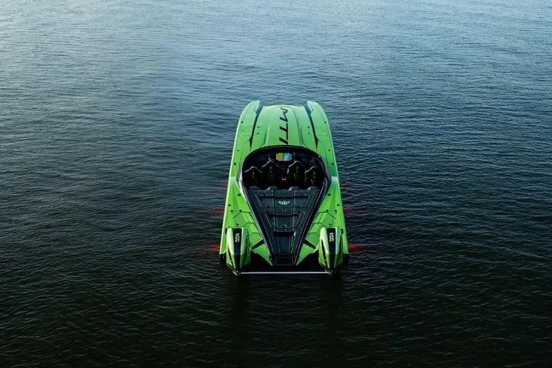  Yacht Photos Pics Green MTI 440X powerboat on water, rear view, 2025 model.