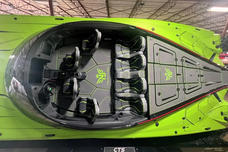  Yacht Photos Pics 2025 MTI 440X boat interior, vibrant green design, spacious seating, modern controls.