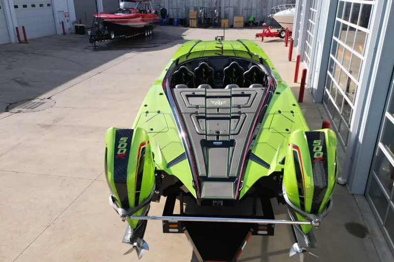  Yacht Photos Pics 2025 MTI 440X powerboat with vibrant green design and dual 500R engines.