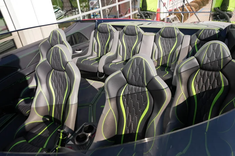  Yacht Photos Pics Luxurious MTI 440X 2025 boat interior with stylish black and green seating arrangement.