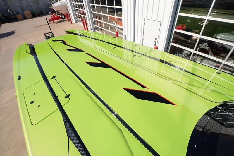  Yacht Photos Pics Bright green MTI 440X boat, 2025 model, with sleek black and red accents.