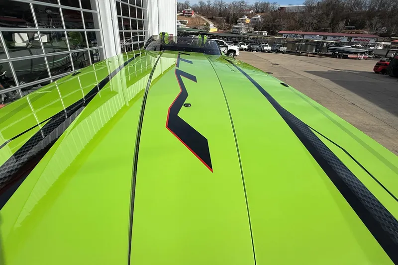  Yacht Photos Pics Bright green MTI 440X boat with sleek black and red accents, 2025 model.