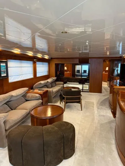  Yacht Photos Pics Luxurious interior of 1999 Alalunga Navetta 30 yacht with plush seating and wooden accents.