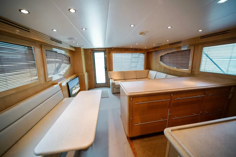 Big Boyd Yacht Photos Pics Interior of 2003 Hatteras 54 Convertible yacht with modern furnishings and ample seating.