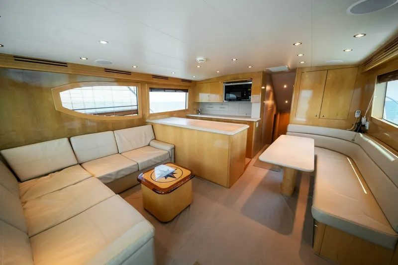 Big Boyd Yacht Photos Pics Luxurious interior of a 2003 Hatteras 54 Convertible yacht with modern furnishings.