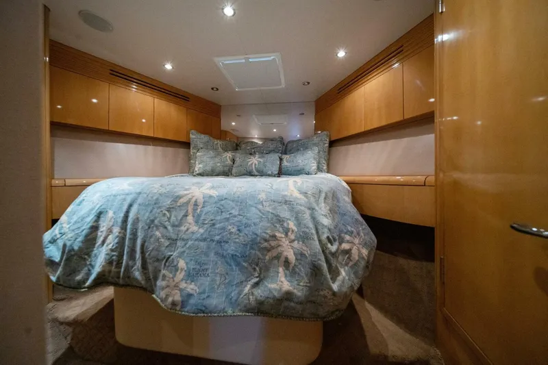 Big Boyd Yacht Photos Pics Luxurious bedroom interior of 2003 Hatteras 54 Convertible yacht with cozy bedding.