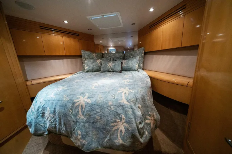 Big Boyd Yacht Photos Pics Luxurious bedroom in 2003 Hatteras 54 Convertible yacht with tropical-themed bedding.