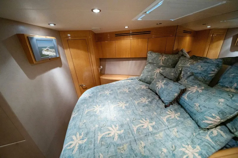 Big Boyd Yacht Photos Pics Luxurious bedroom interior of 2003 Hatteras 54 Convertible yacht with tropical-themed bedding.