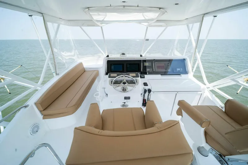 Big Boyd Yacht Photos Pics Helm of 2003 Hatteras 54 Convertible yacht with ocean view.