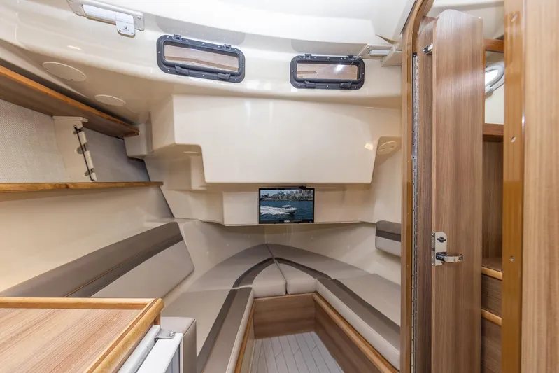  Yacht Photos Pics Interior of 2025 Solara S-310 CW boat, featuring cozy seating and modern design.